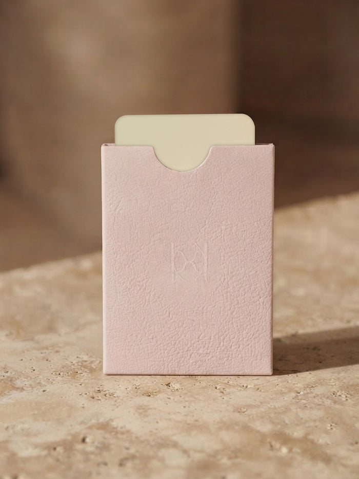 KIVARI pink textured physical gift card holder on stone surface