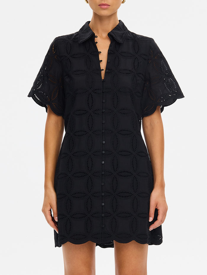 Black dress with geometric pattern on a white background