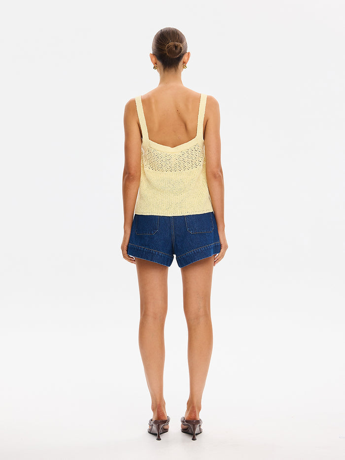 Sally Knit Cami in Butter yellow, back view of crochet knit tank top with denim shorts