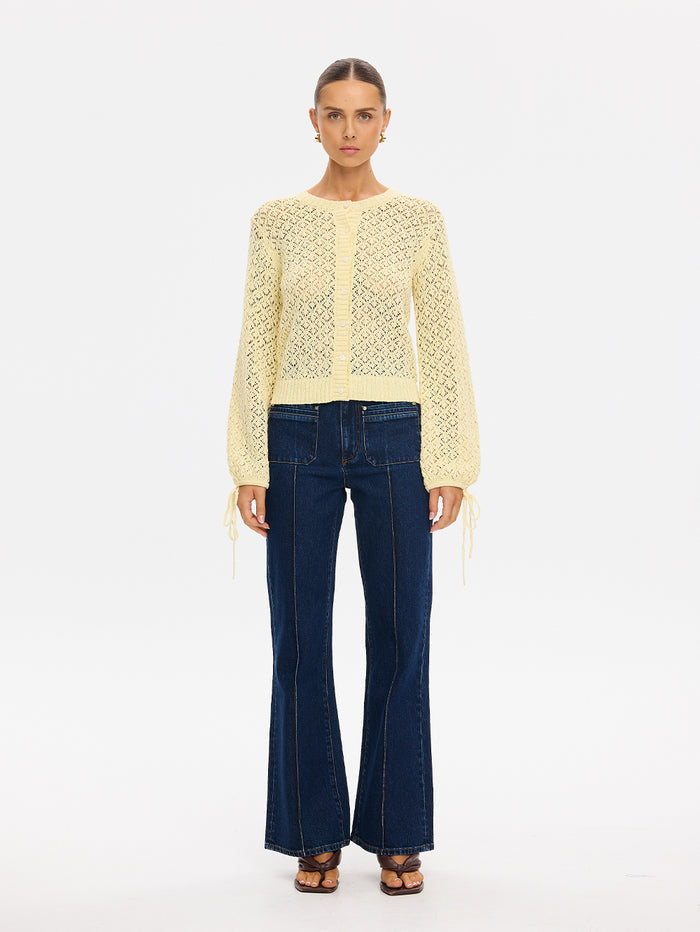 Sally Knit Cardigan in Butter yellow, open-knit long-sleeve cardigan styled with flared denim jeans and sandals