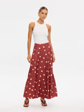 KIVARI Saro Maxi Skirt in Brick – polka dot maxi skirt styled with a white tank top, front view