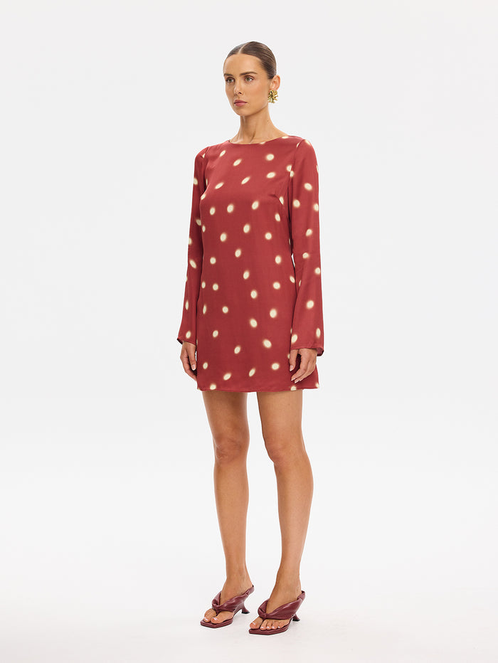 KIVARI Saro Mini Dress in Brick – long-sleeve polka dot mini dress, scoop neckline front view