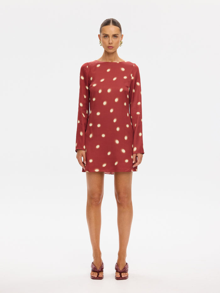 KIVARI Saro Mini Dress in Brick – long-sleeve polka dot mini dress, front view on model