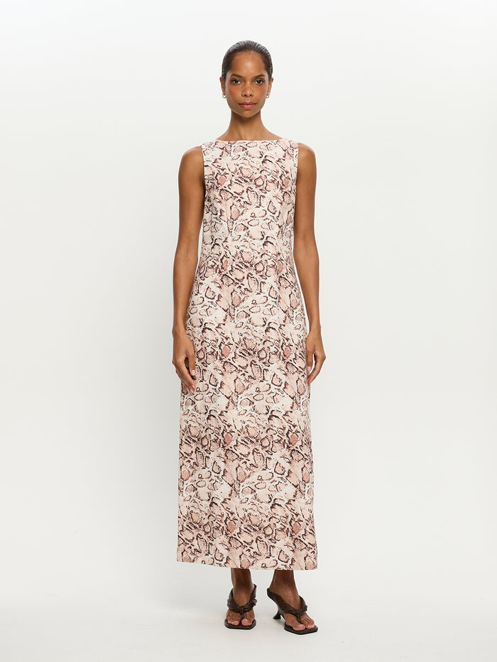 Woman wearing a sleeveless floral dress on a white background
