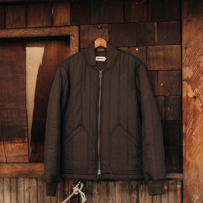 editorial image of The Able Jacket in Soil Quilted Nylon on a hanger