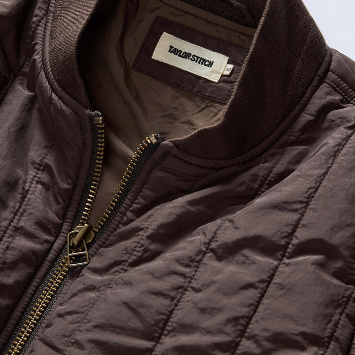 material shot of the collar on The Able Jacket in Soil Quilted Nylon