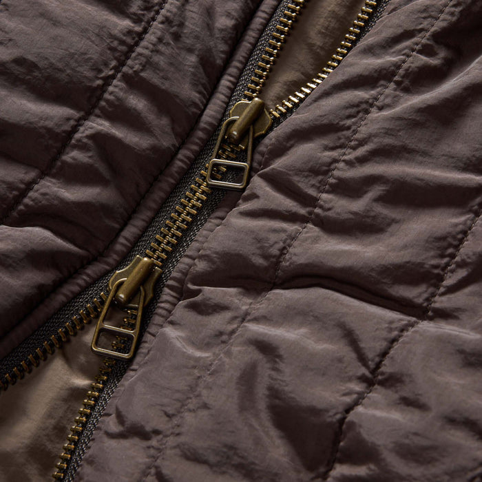 material shot of the zipper on The Able Jacket in Soil Quilted Nylon