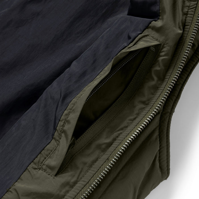 material shot of the interior pocket on The Able Vest in Quilted Army