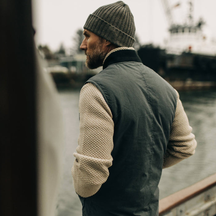 fit model showing back of The Anchorage Vest in Charcoal Dry Wax