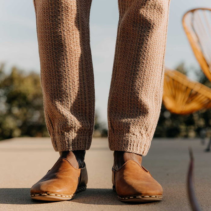fit model showing off the cuffs on The Apres Pant in Baja Stripe