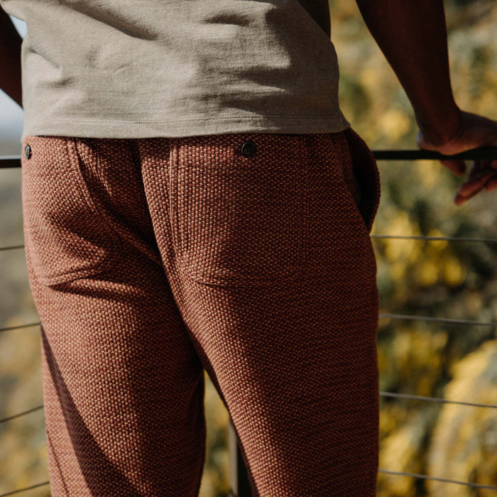 fit model showing the back of The Apres Pant in Black Cherry Sashiko