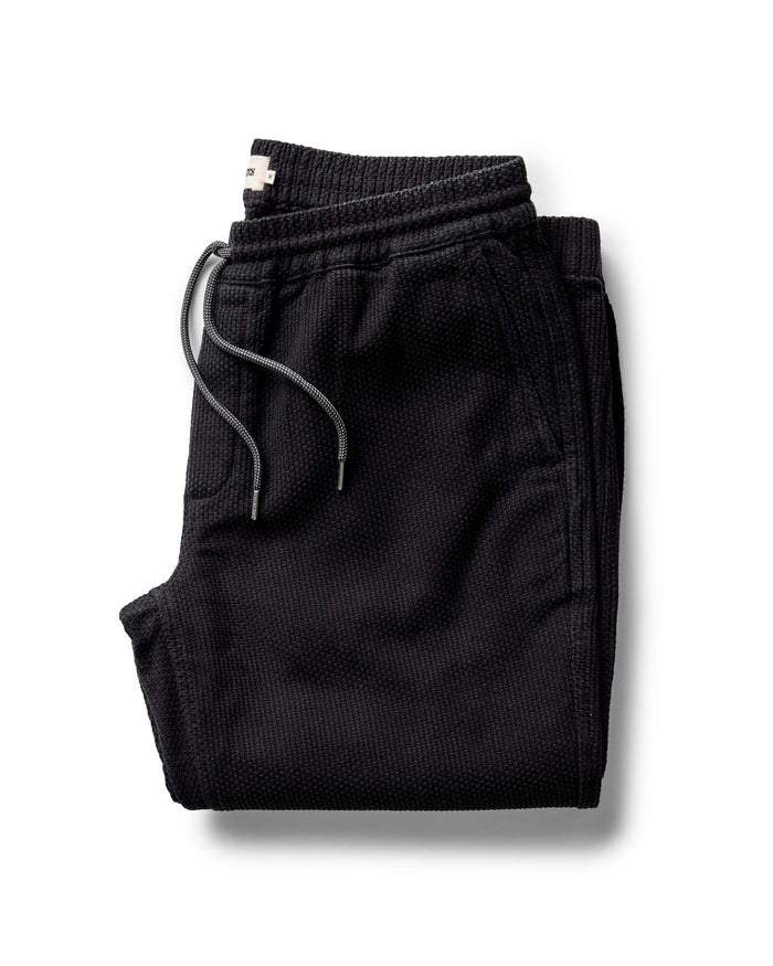 folded flatlay of The Apres Pant in Black Indigo Sashiko