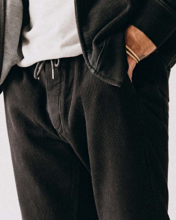fit model posing in The Apres Pant in Black Indigo Sashiko