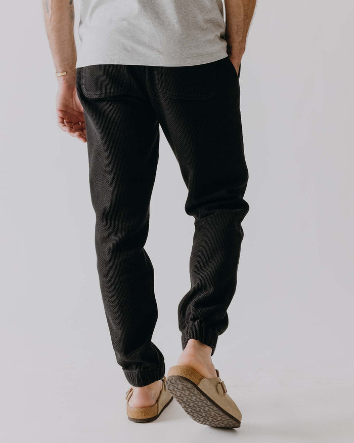 fit model showing off the back of The Apres Pant in Black Indigo Sashiko