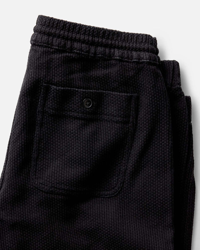 material shot of the back pocket on The Apres Pant in Black Indigo Sashiko