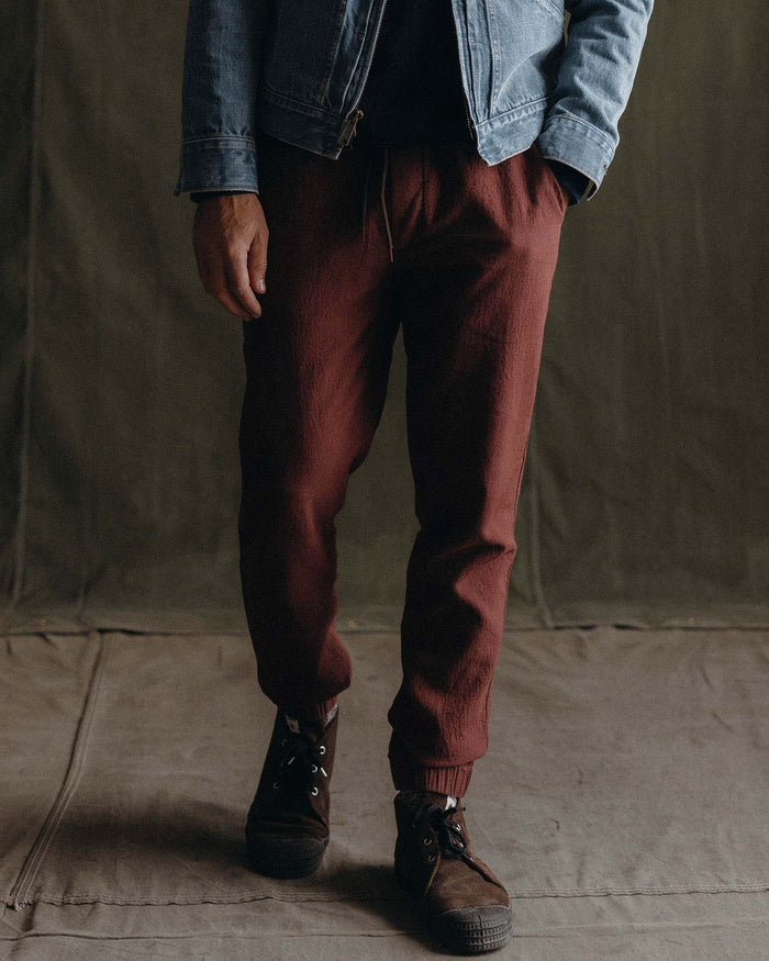 fit model posing in The Apres Pant in Burgundy Double Cloth