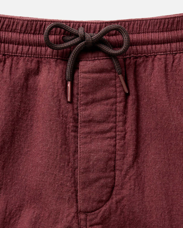material shot of the waistband on The Apres Pant in Burgundy Double Cloth