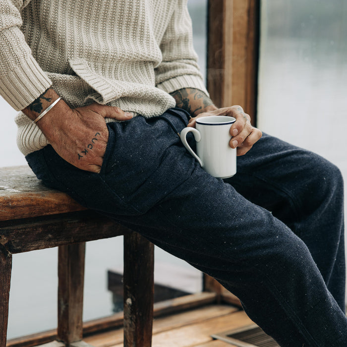fit model sitting in The Apres Pant in Charcoal Donegal