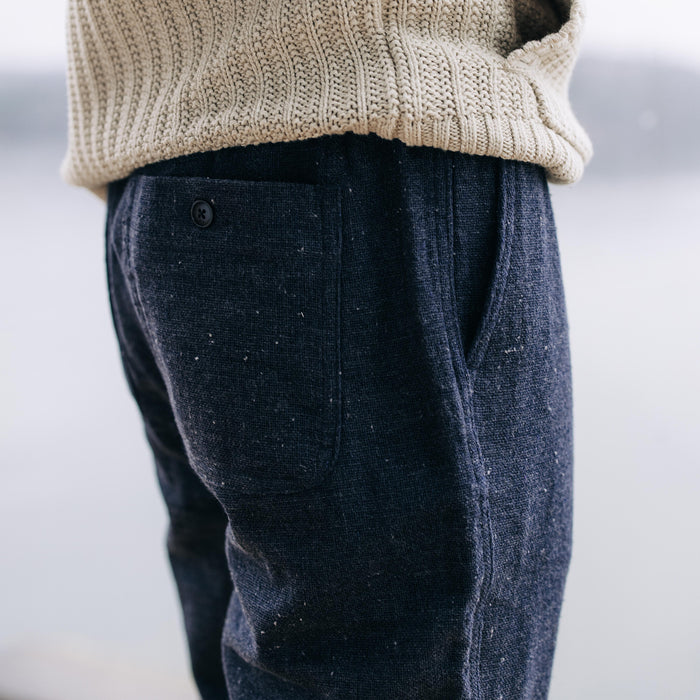 fit model showing the back of The Apres Pant in Charcoal Donegal