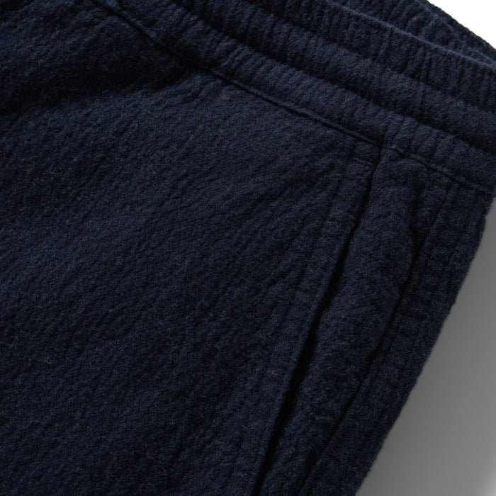 material shot of the pocket on The Apres Pant in Charcoal Double Cloth