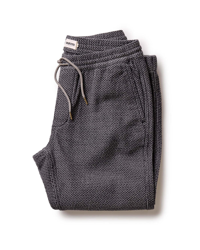 folded flatlay of the apres pant in charcoal sashiko
