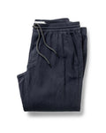 folded flatlay of The Apres Pant in Coal Double Cloth