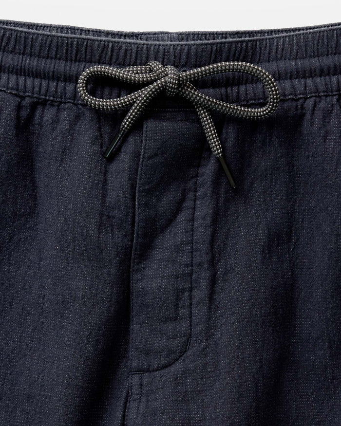 material shot of the waistband on The Apres Pant in Coal Double Cloth
