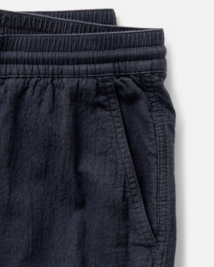 material shot of the pocket on The Apres Pant in Coal Double Cloth