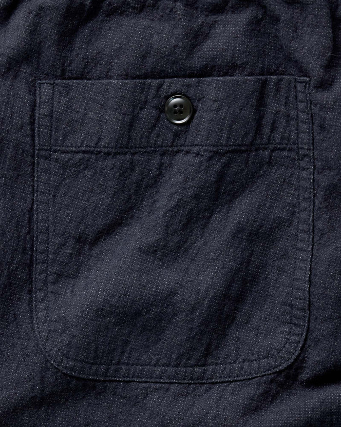material shot of the back pocket on The Apres Pant in Coal Double Cloth