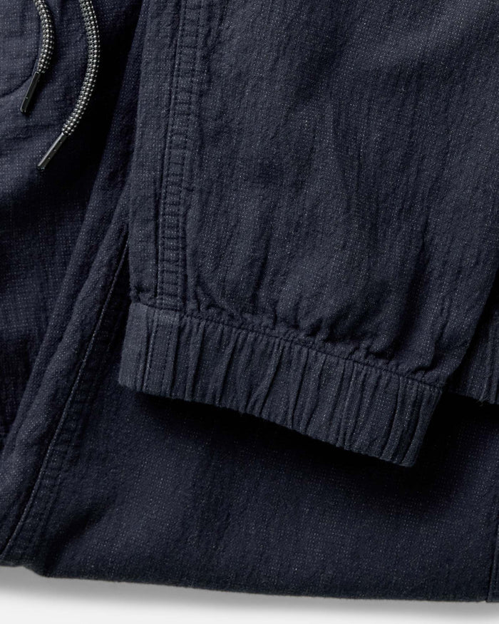 material shot of the cuffs on The Apres Pant in Coal Double Cloth