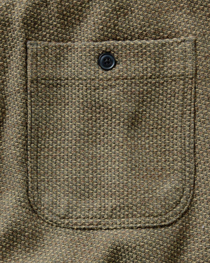 material shot of the back pocket on The Apres Pant in Cypress Sashiko