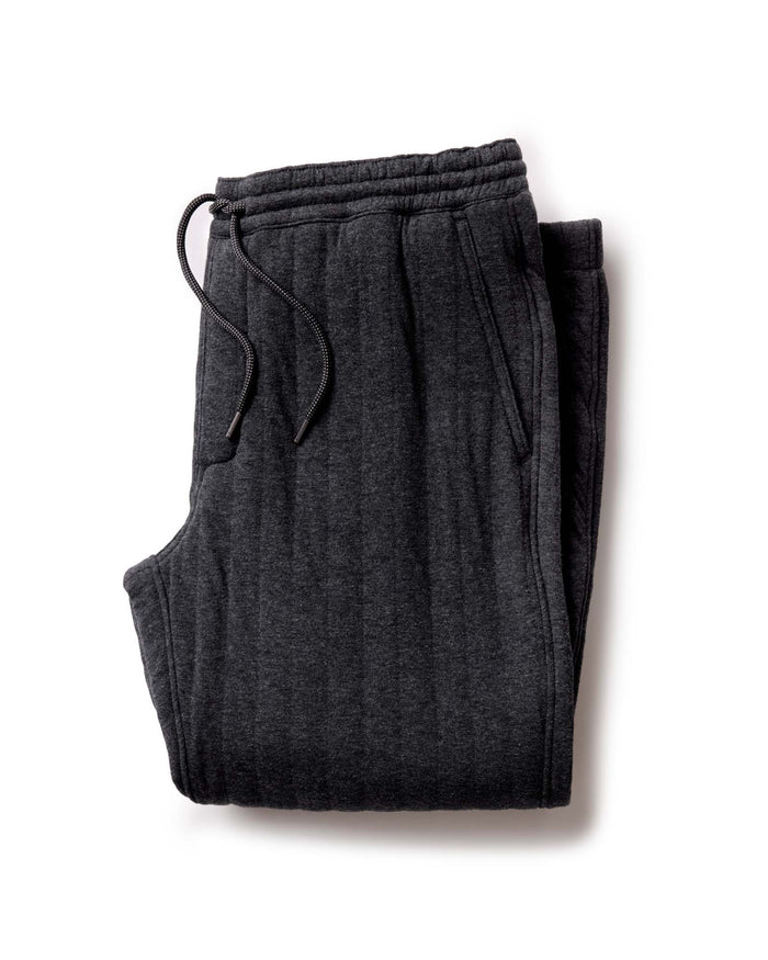 folded flatlay of The Apres Pant in Heather Coal Quilted Jersey