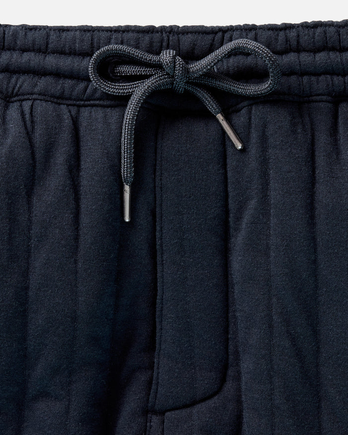 flatlay of The Quilted Apres Pant in Heather Midnight Jersey