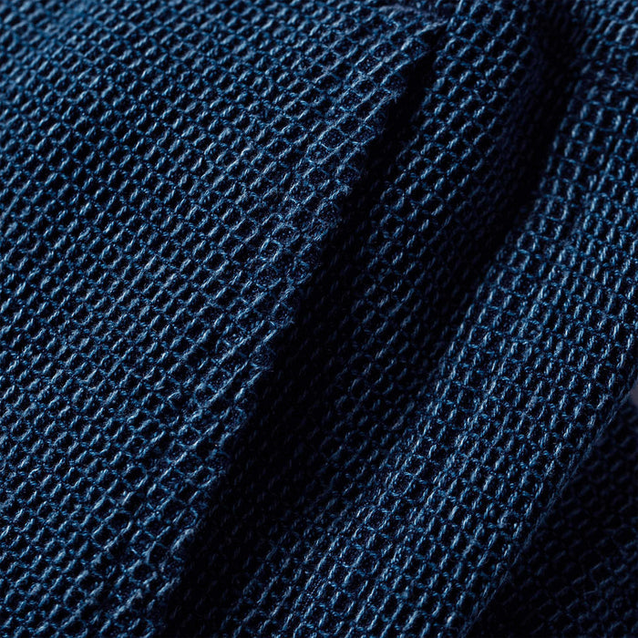 material shot of the pocket on The Apres Pant in Indigo Waffle
