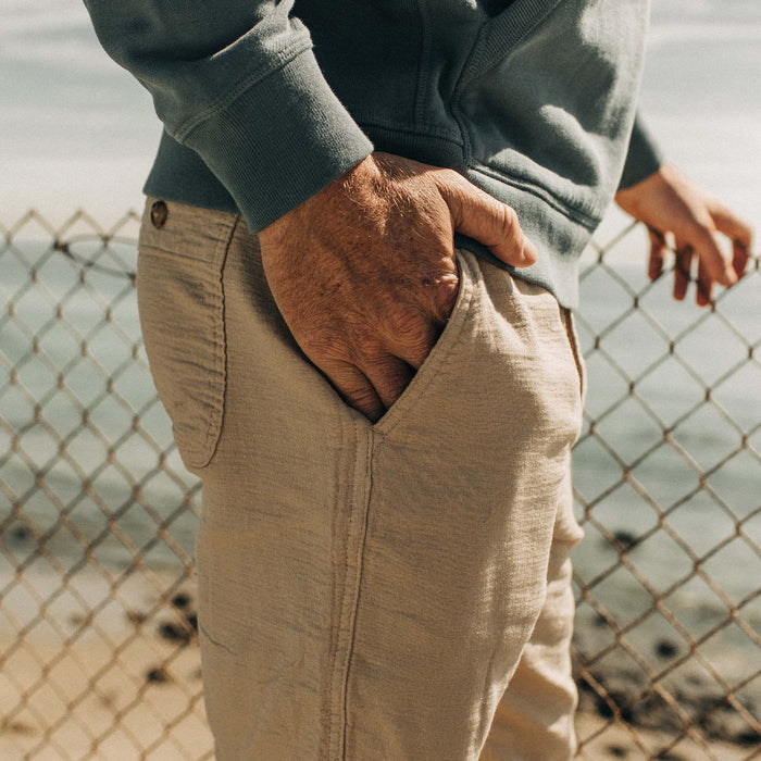 fit model posing with his hand in the pocket of The Apres Pant in Khaki Double Cloth
