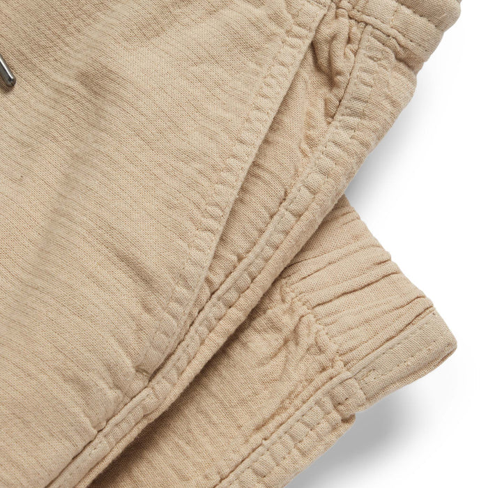 material shot of the pockets on The Apres Pant in Khaki Double Cloth