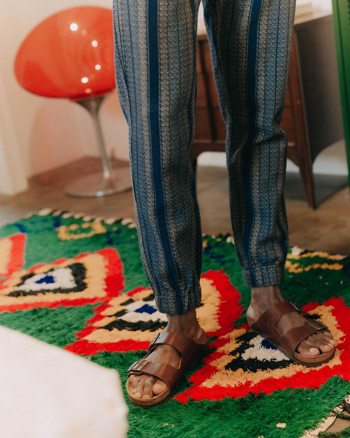 fit model showing off the cuffs on The Apres Pant in Marine Stripe