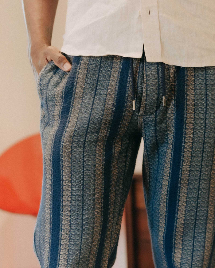 fit model showing off the back pockets on The Apres Pant in Marine Stripe