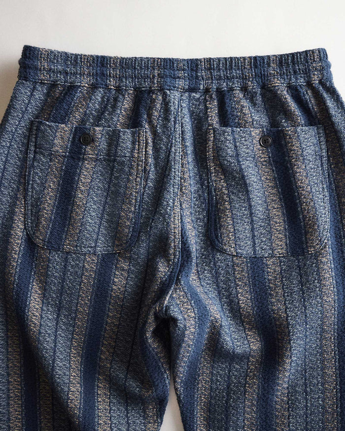 folded flatlay of the back of The Apres Pant in Marine Stripe