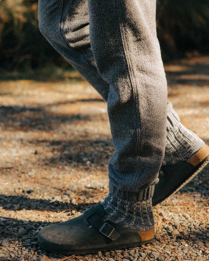fit model sitting in The Apres Pant in Navy Linen Tweed