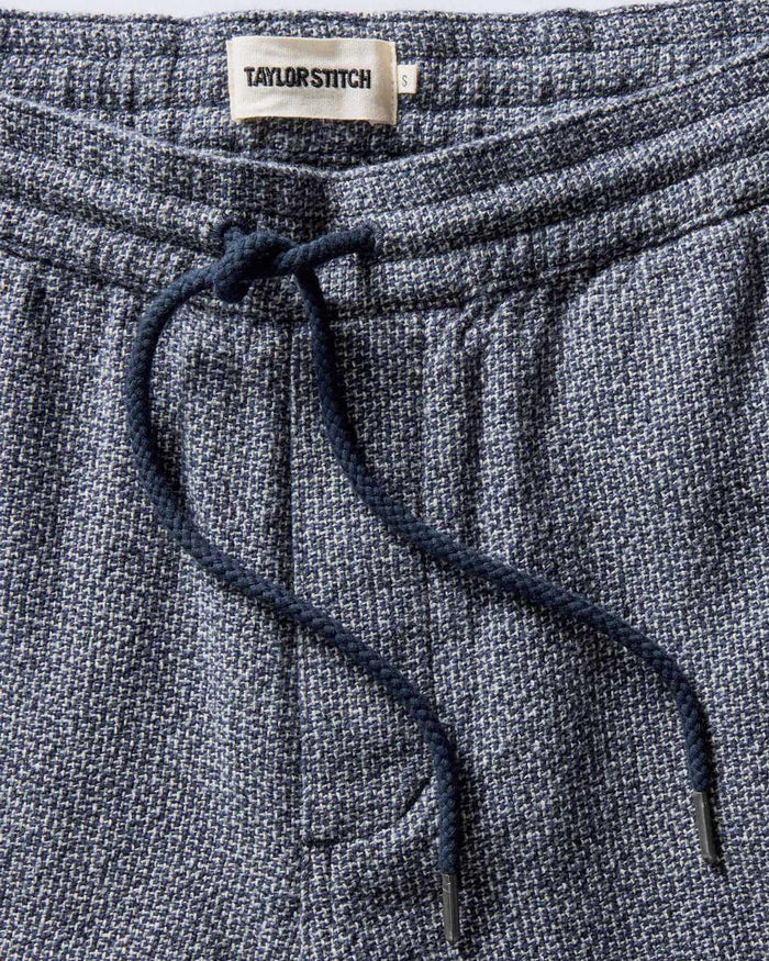 folded flatlay of The Apres Pant in Navy Linen Tweed, from the back