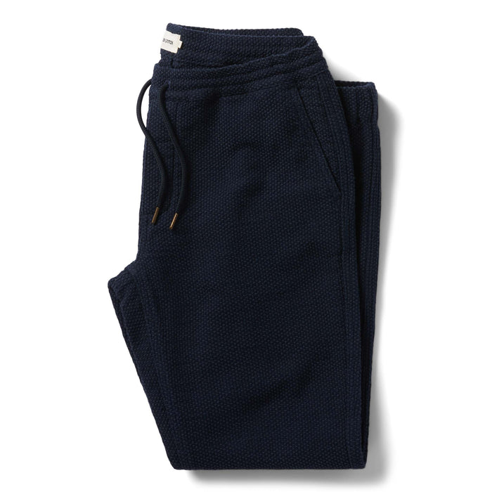 flatlay of The Apres Pant in Navy Sashiko folded