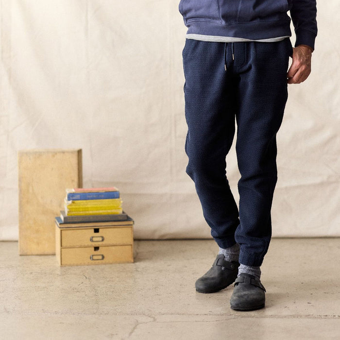 fit model posing in The Apres Pant in Navy Sashiko