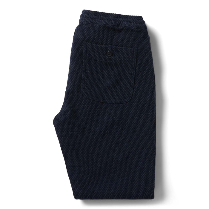 flatlay of the back of The Apres Pant in Navy Sashiko folded