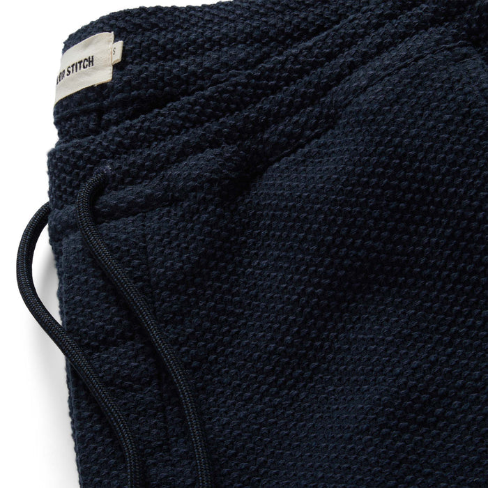 material shot of the drawstring and band of The Apres Pant in Navy Sashiko