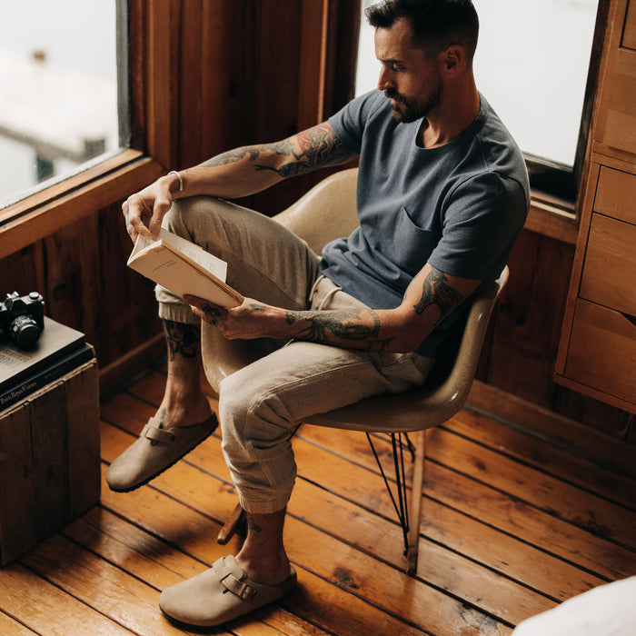 fit model sitting in The Apres Pant in Oat Donegal