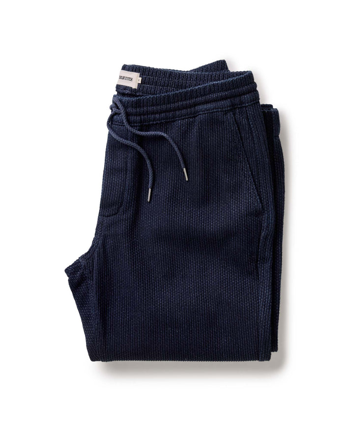 folded flatlay of The Apres Pant in Rinsed Indigo Sashiko