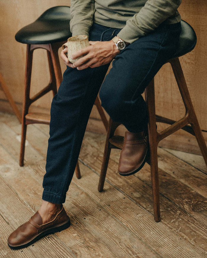 editorial image of The Apres Pant in Rinsed Indigo Sashiko hanging