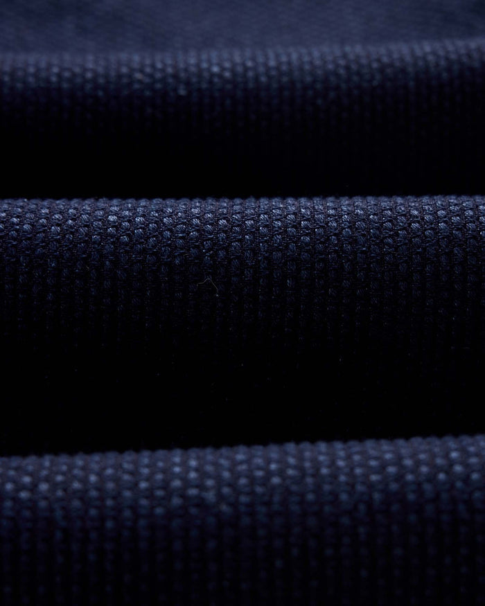 folded flatlay of the back of The Apres Pant in Rinsed Indigo Sashiko