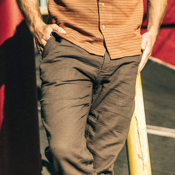 fit model with his hands in the pockets of The Apres Pant in Walnut Double Cloth